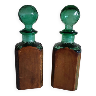 2 glass bottles with leather