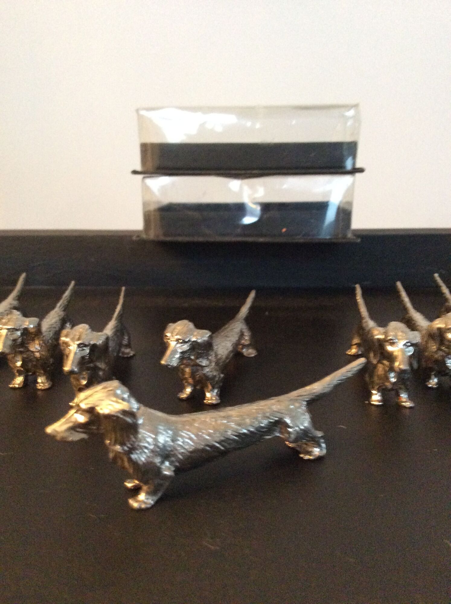 Series of 12 vintage dachshund knife holders in silver metal