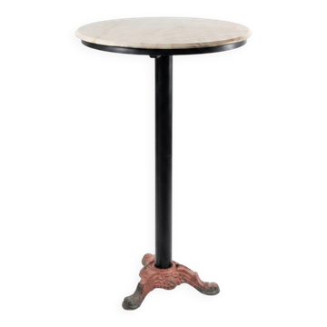 Bistro standing table with marble top and cast iron base.