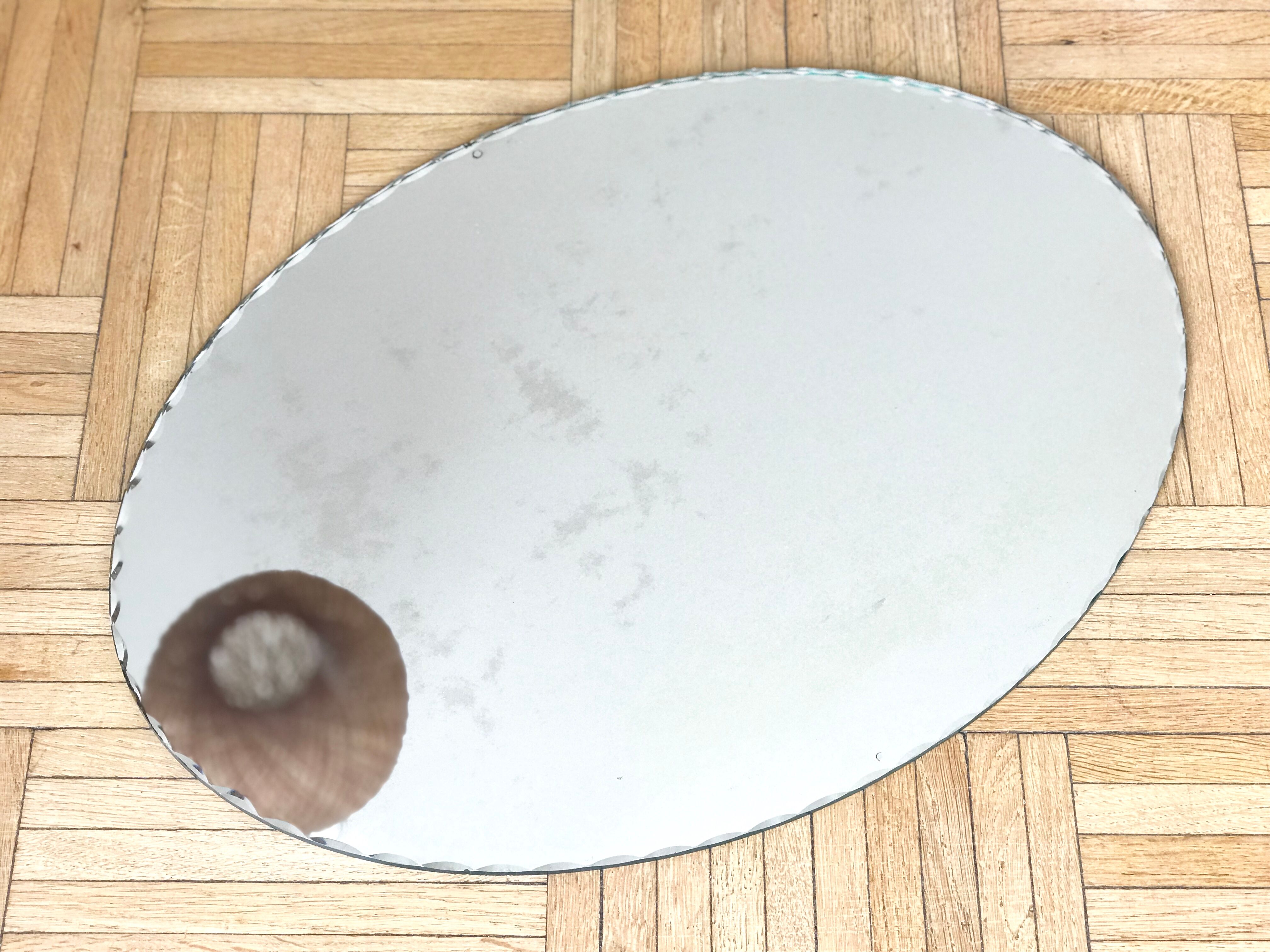 Oval mirror bevelled with removable metal media 43x60cm
