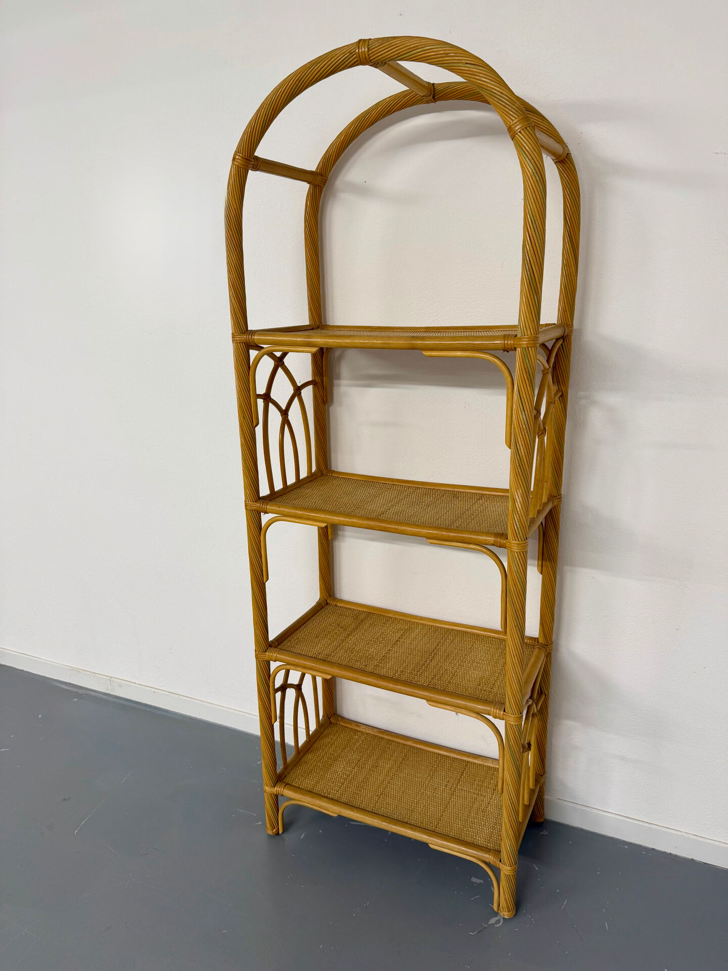 Large woven rattan bookshelf designed in the 1970s.