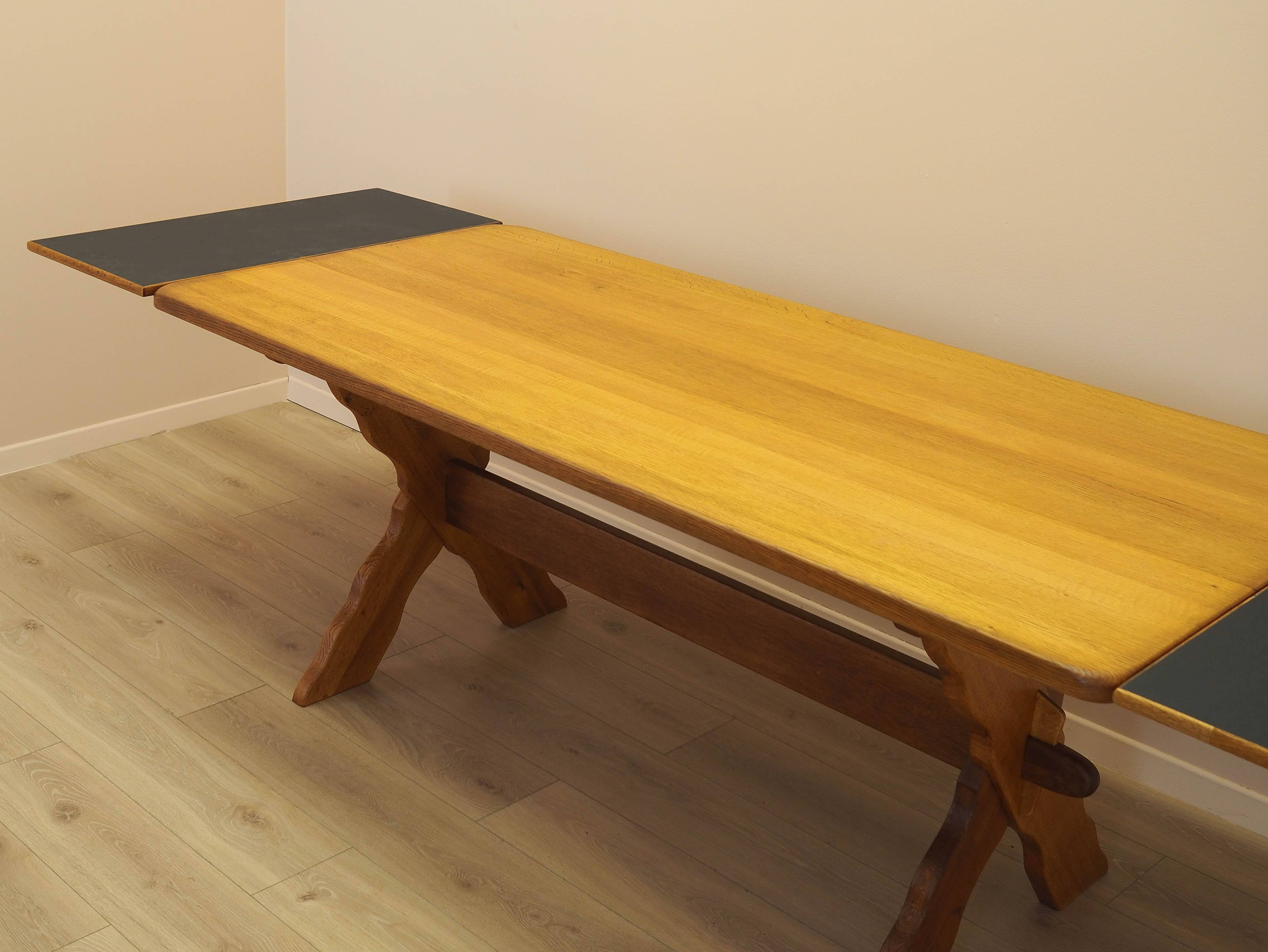 Solid oak dining table by Henning Kjærnulf, Denmark, 1960s