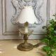Ancient cave lamp in gilded bronze