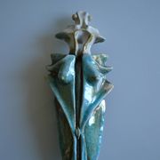 Surreal ceramic sculpture in relief signed to be identified.
