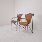 Pair of wicker and iron armchairs by Frederic Weinberg, United States, 1950s.