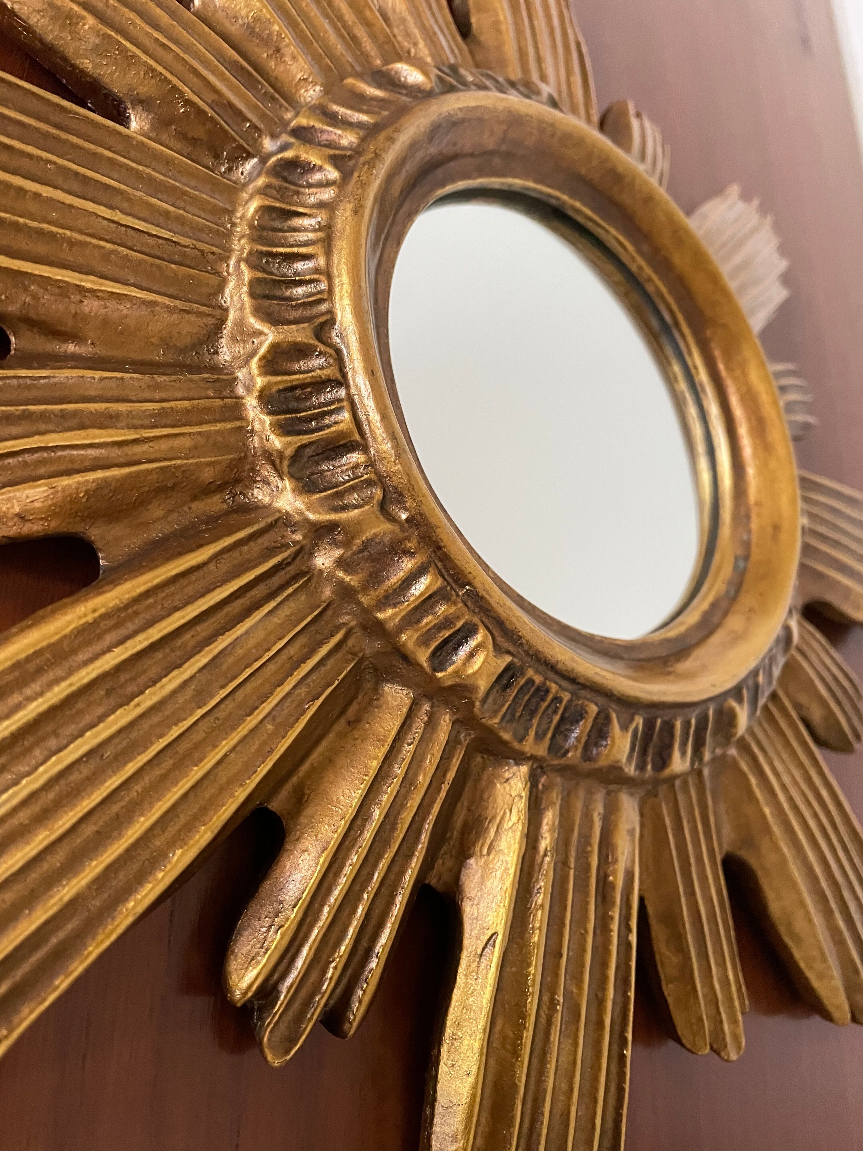 Vintage sun mirror in 60s/70s gold resin