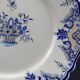 Ancien plat en faïence décor au panier fleuri