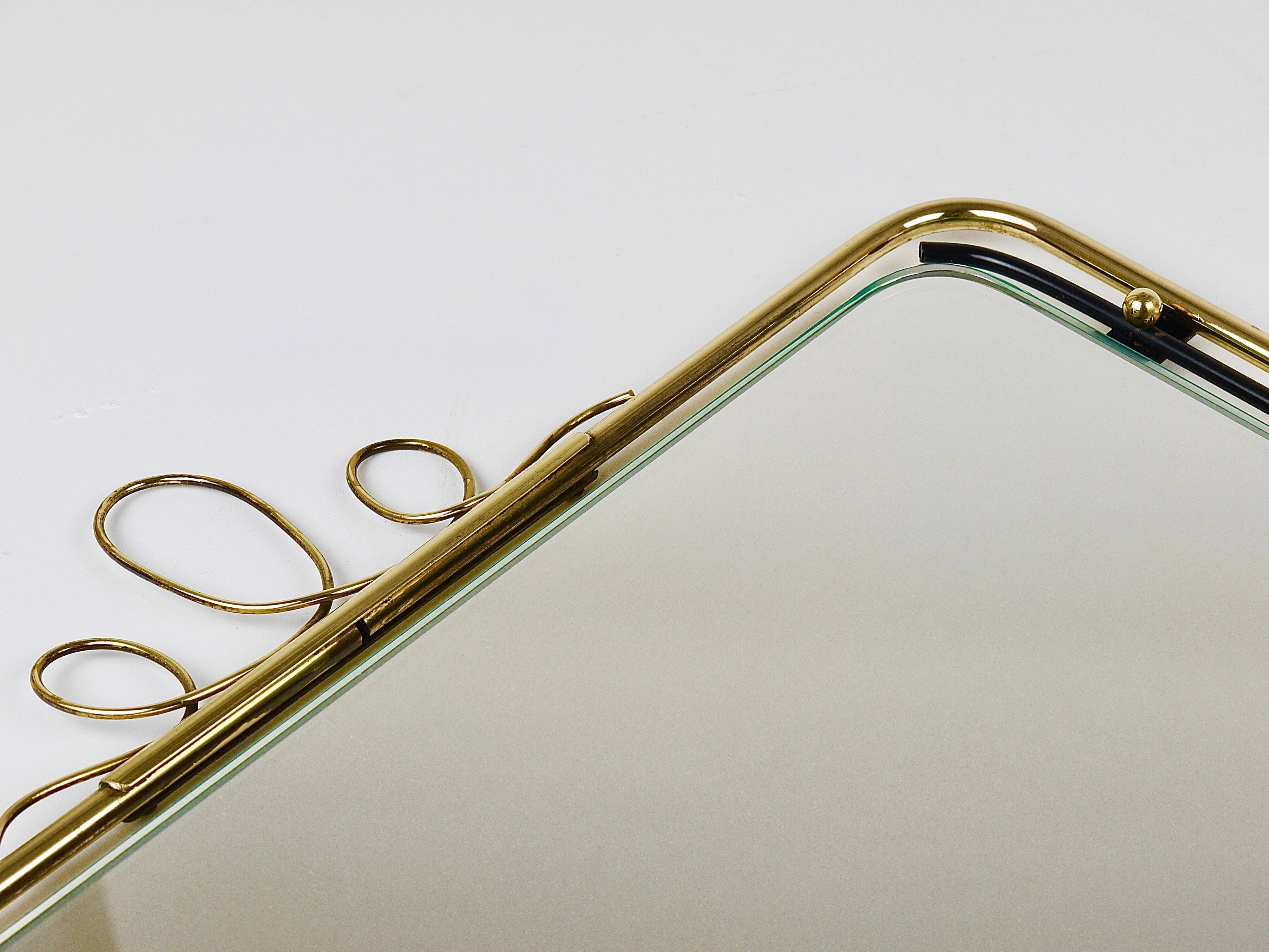 Wall mirror in brass wire with modernist loops from the mid-century, Italy, 1950s.