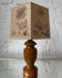 Turned wood lamp with a herbarium lampshade from the 1970s.