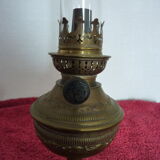 Old German kerosene lamp on foot in yellow copper period 19th German petroleum lamp