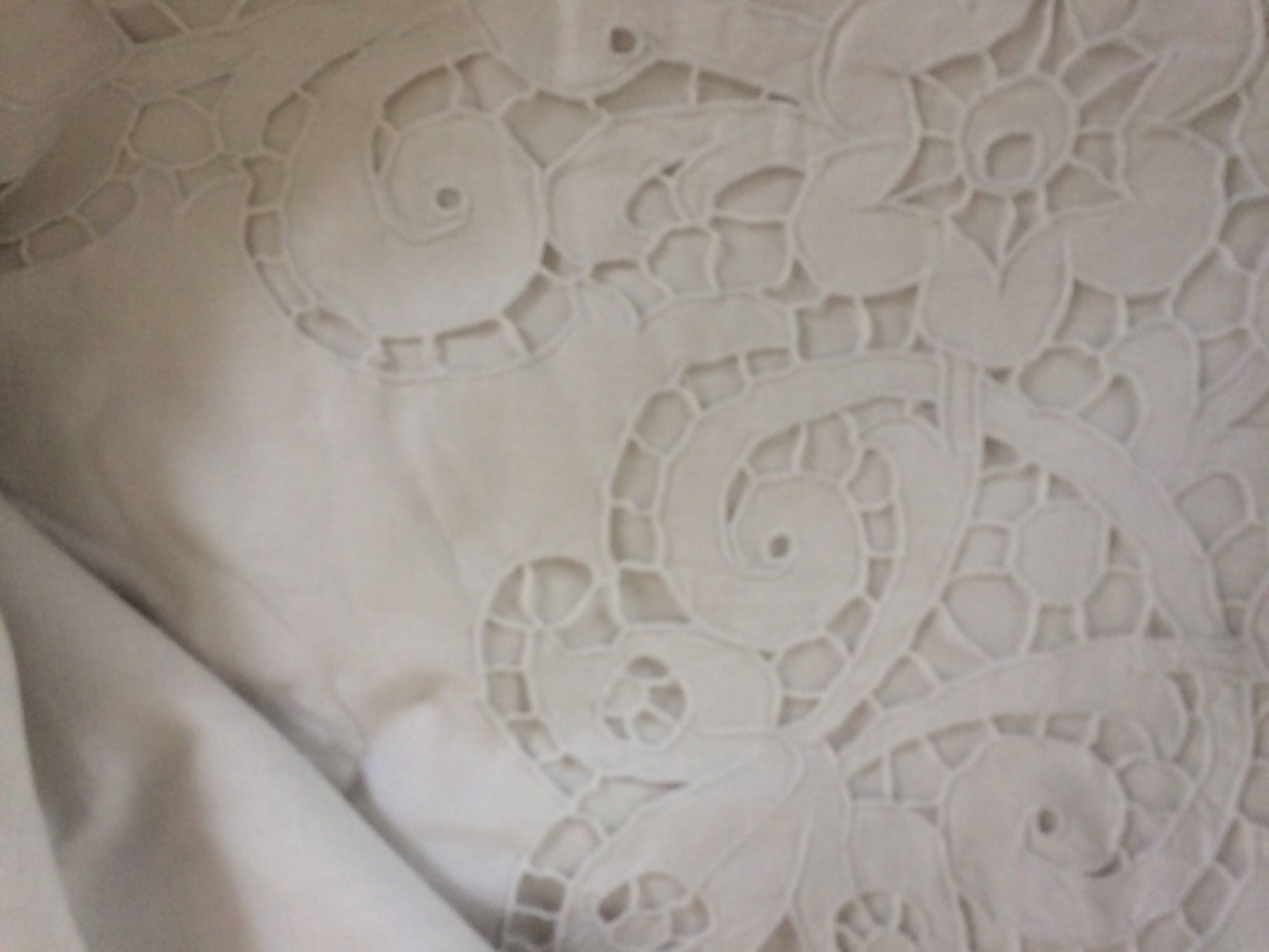 Old sheet with monograms and wide hand made embroider.