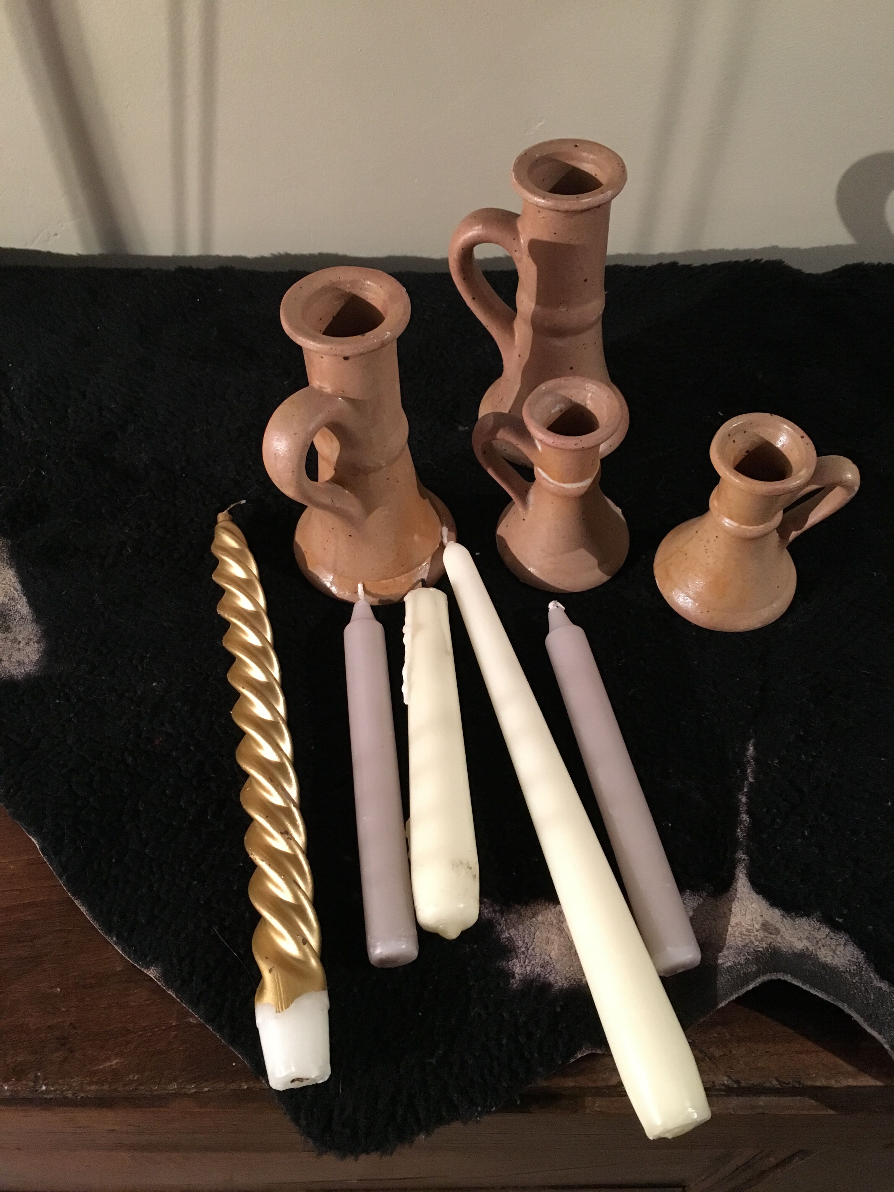 Set of 4 candlesticks in sandstone