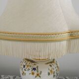 Table lamp with wooden base and fringed shade
