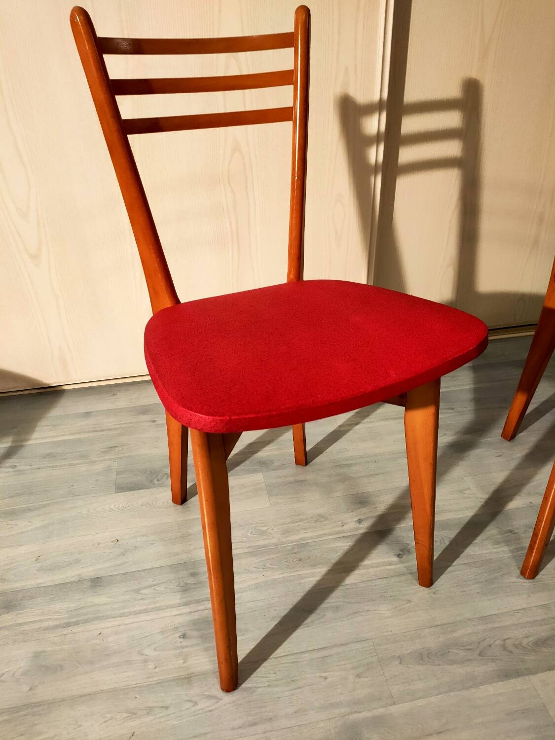 Pair of vintage wooden and leatherette chairs