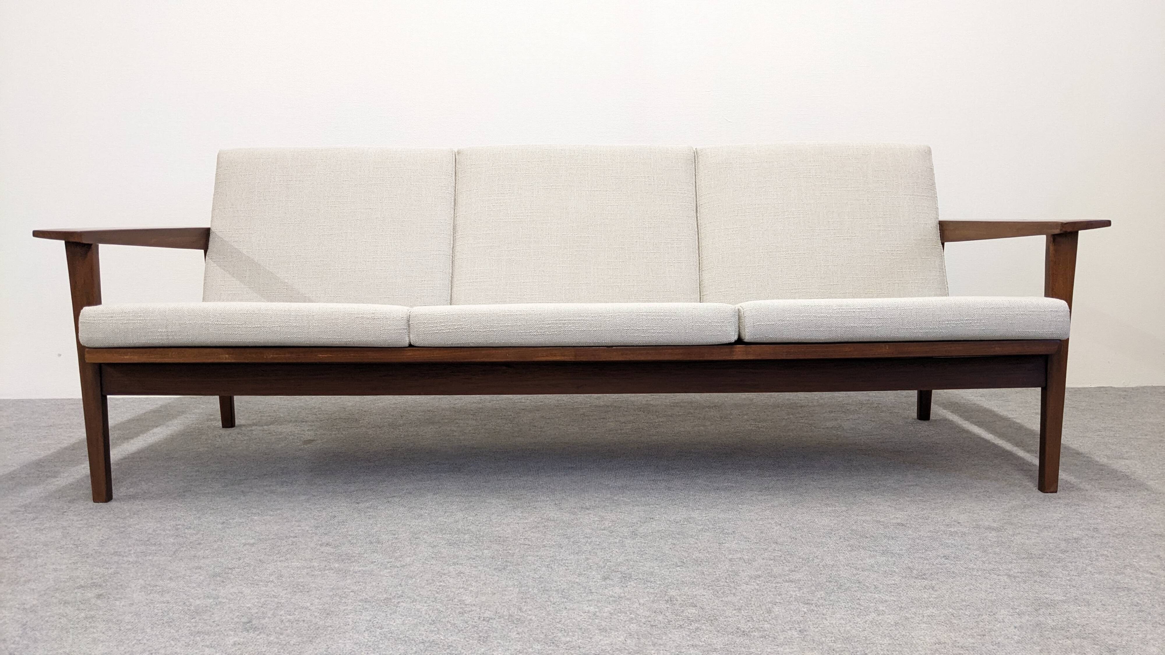 Scandinavian style three-seater sofa in teak, France circa 1950.
