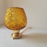 Bedside lamp in amber glass and brass