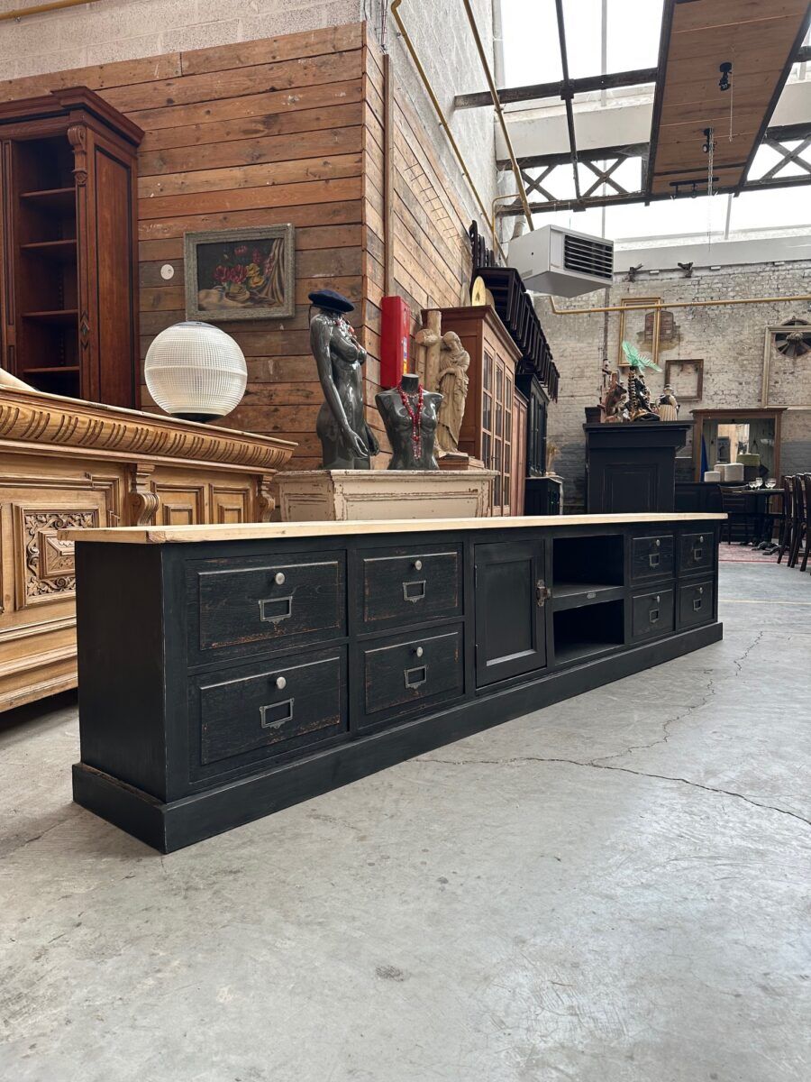 Old workshop furniture transformed into a TV unit.