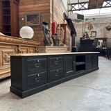 Old workshop furniture transformed into a TV unit.
