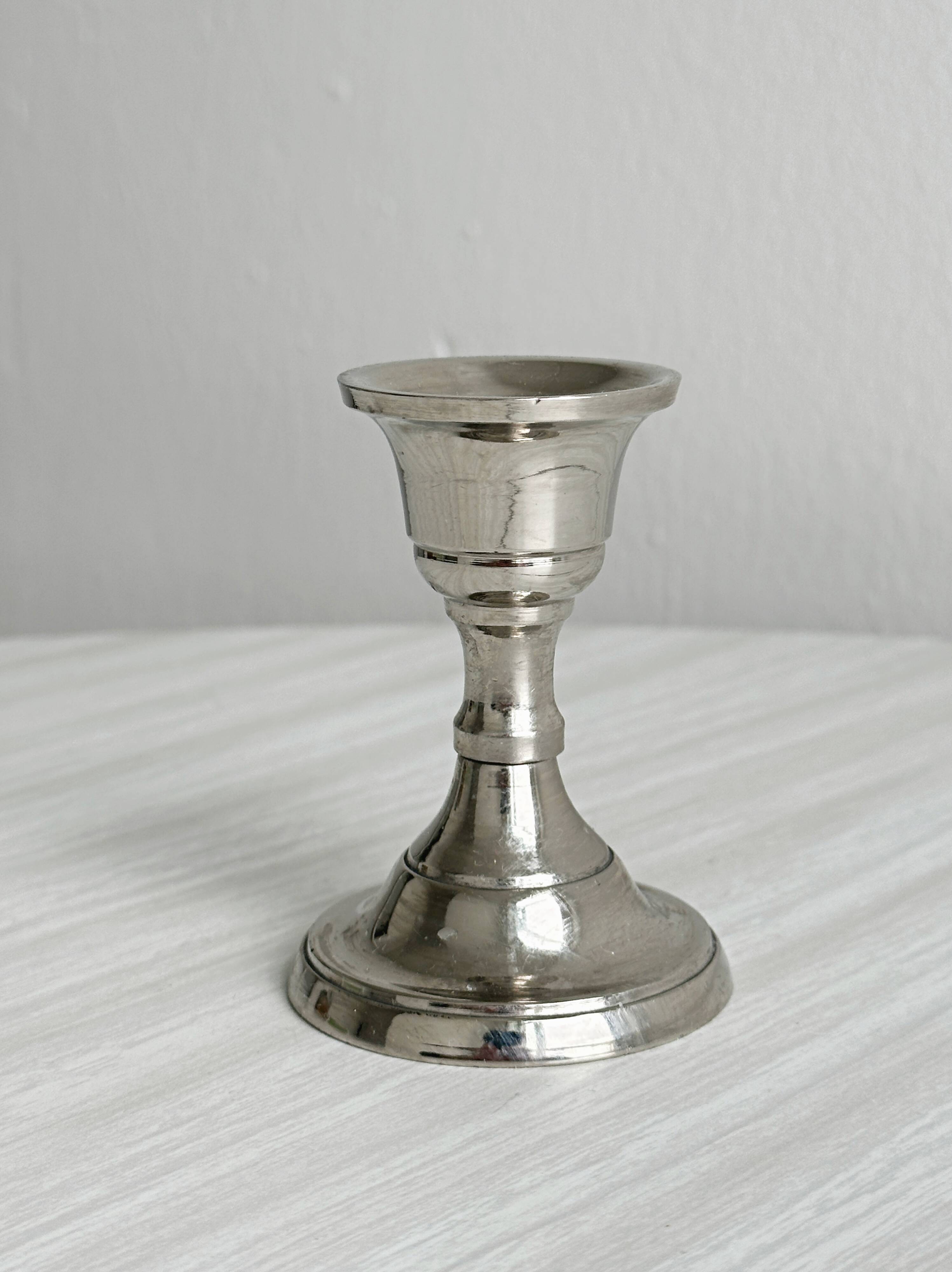 Small lightweight metal candlestick