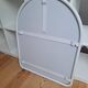 Arch mirror in white tubular steel frame from the 80s