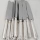 Ercuis Trianon, Rubans, 12 silver-plated table knives, excellent condition.