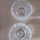 Moulded glass candle holders.