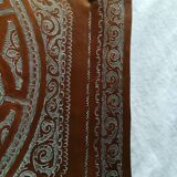 Old oriental tray in chiseled copper