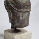 Head of Zeus in patinated plaster in imitation of bronze, 15 cm