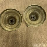 2 gold colored candlesticks