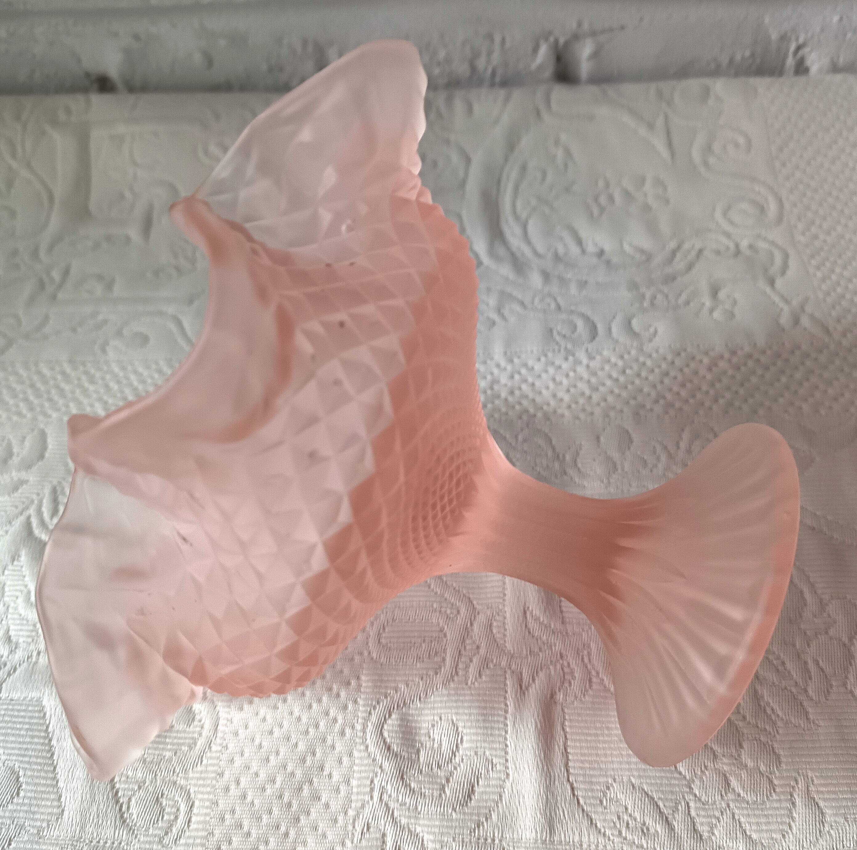 Small pink glass bowl on shabby foot, empty pocket