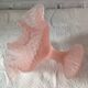 Small pink glass bowl on shabby foot, empty pocket