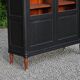 Renovated black antique Louis XVI style display cabinet, glass-fronted bookcase.