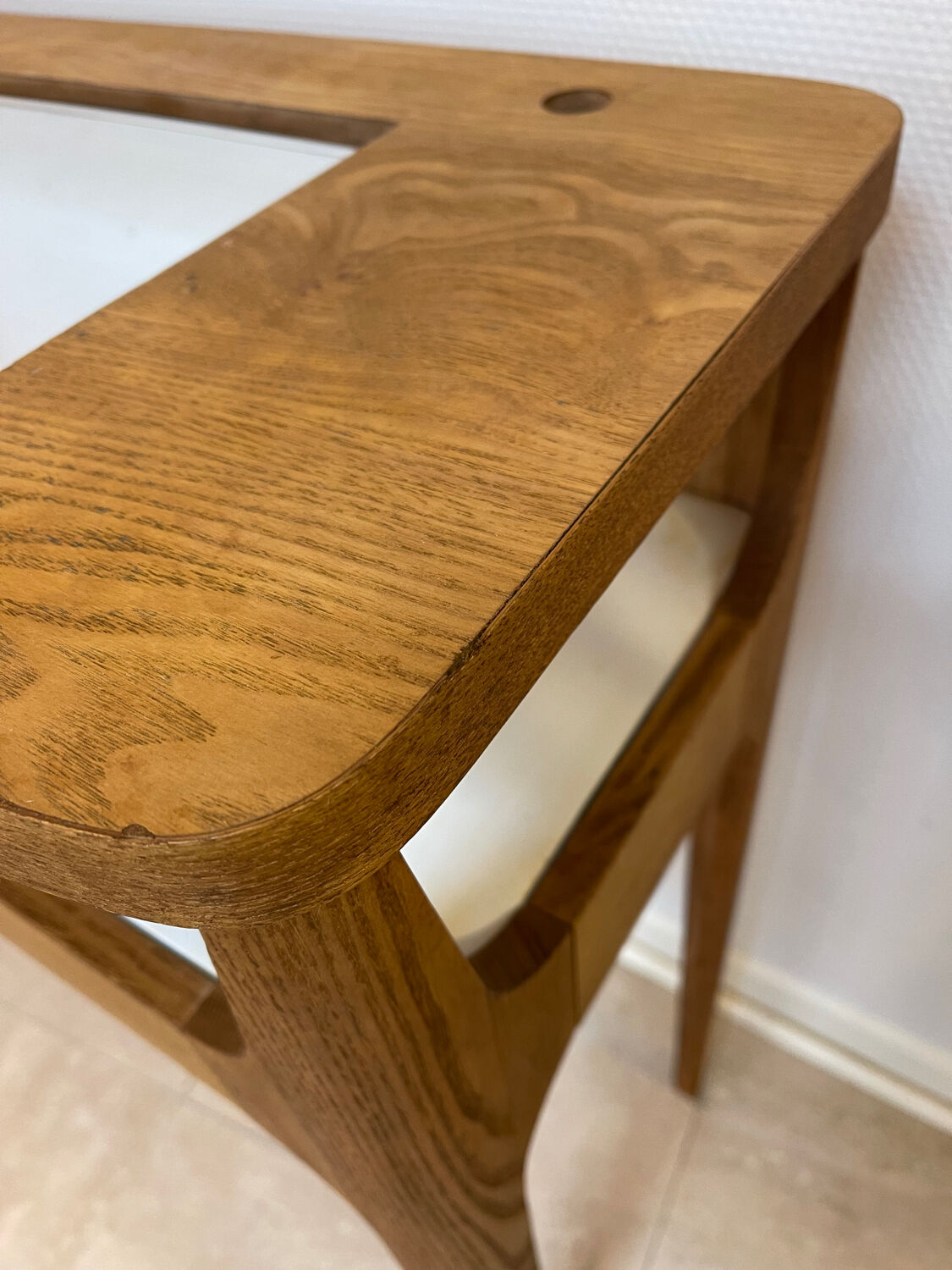 Small contemporary console in stained walnut wood.