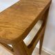 Small contemporary console in stained walnut wood.
