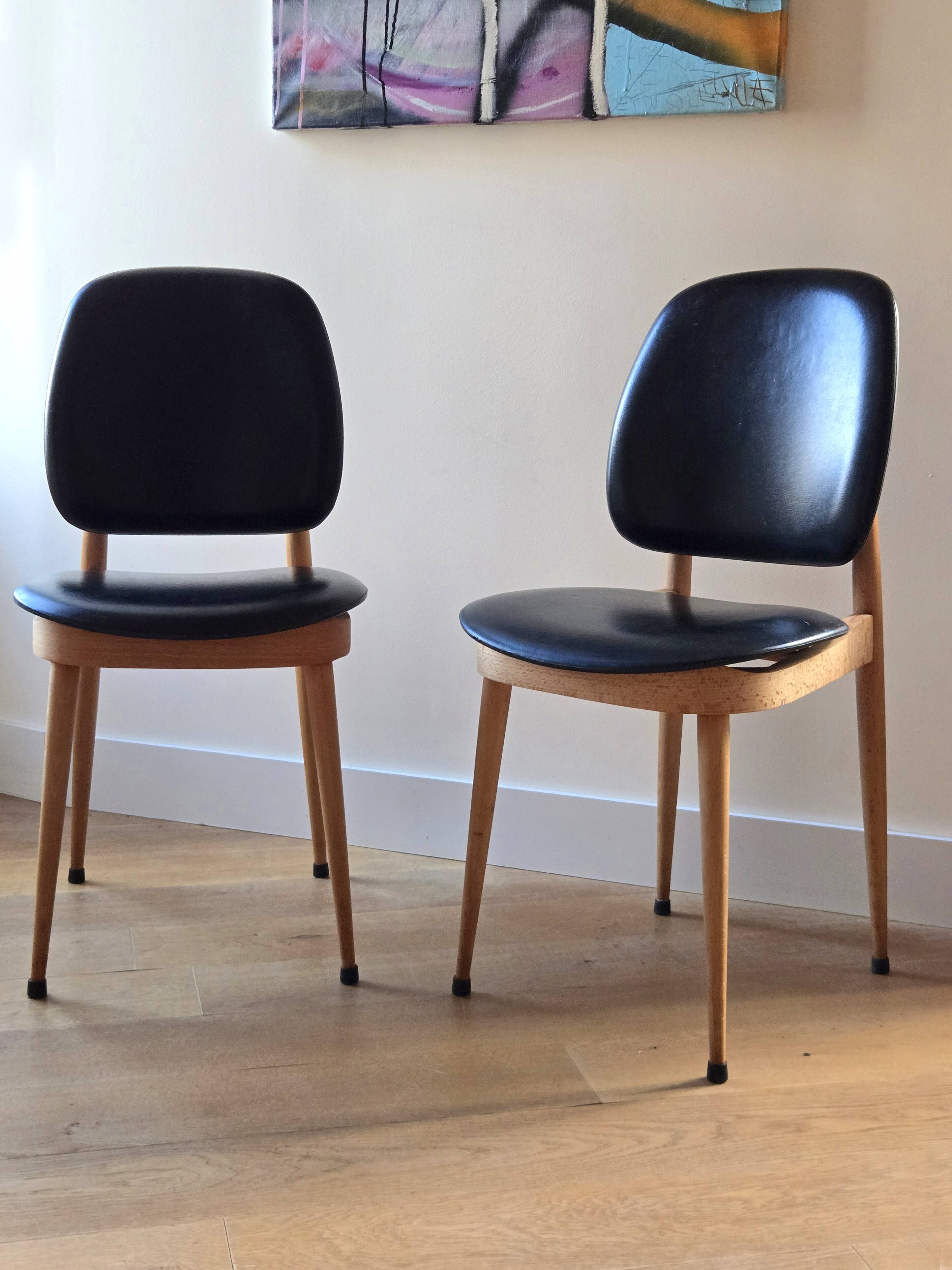Pair of Baumann Pegasus chairs in wood and leather - design by Pierre Guariche