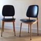 Pair of Baumann Pegasus chairs in wood and leather - design by Pierre Guariche