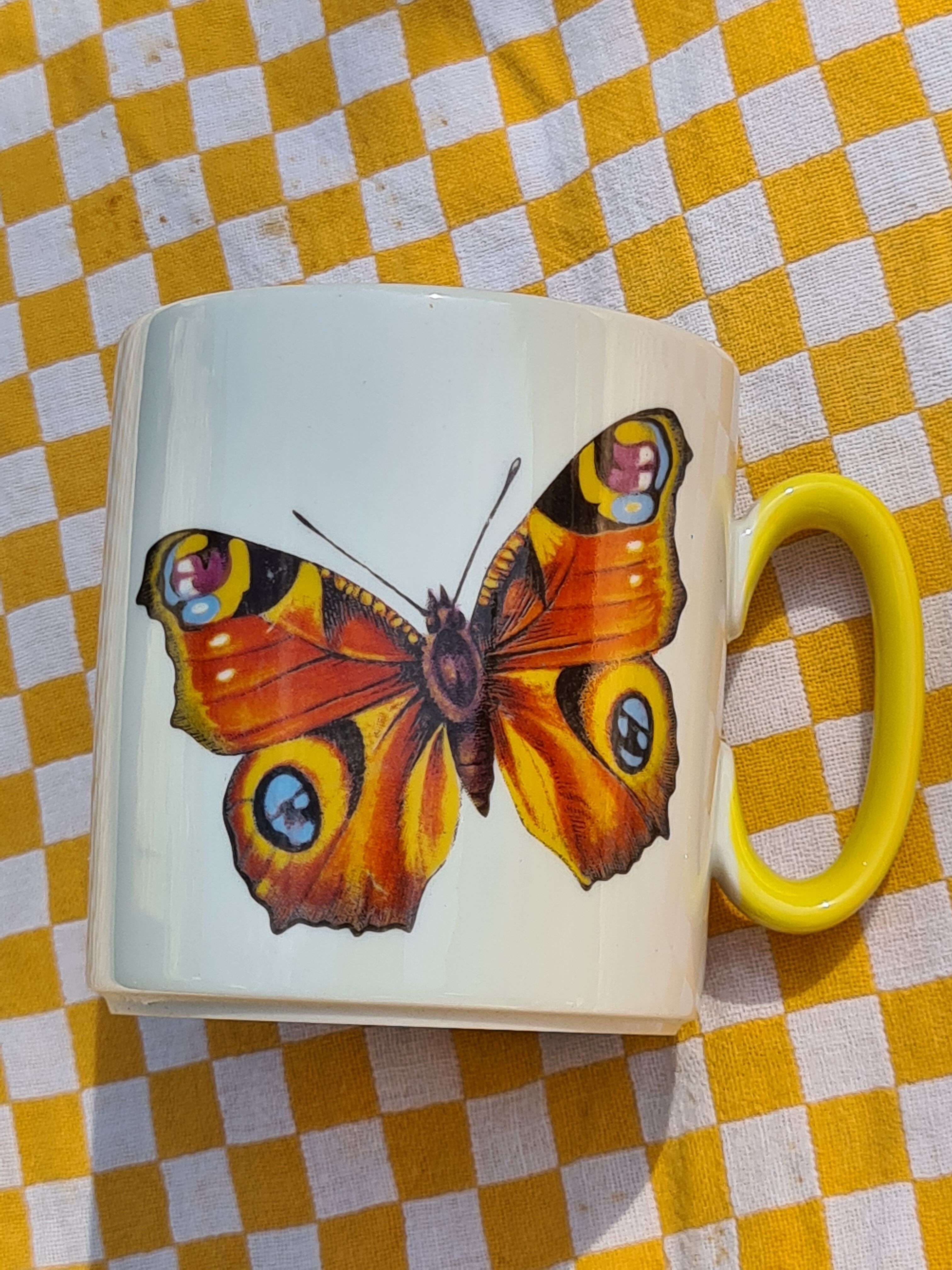 Four mugs decorated with Villeroy and Boch butterflies