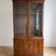 Classic English display cabinet in wood with glass doors.