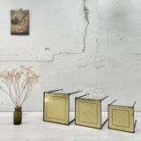 Suite of metal and glass nesting tables.