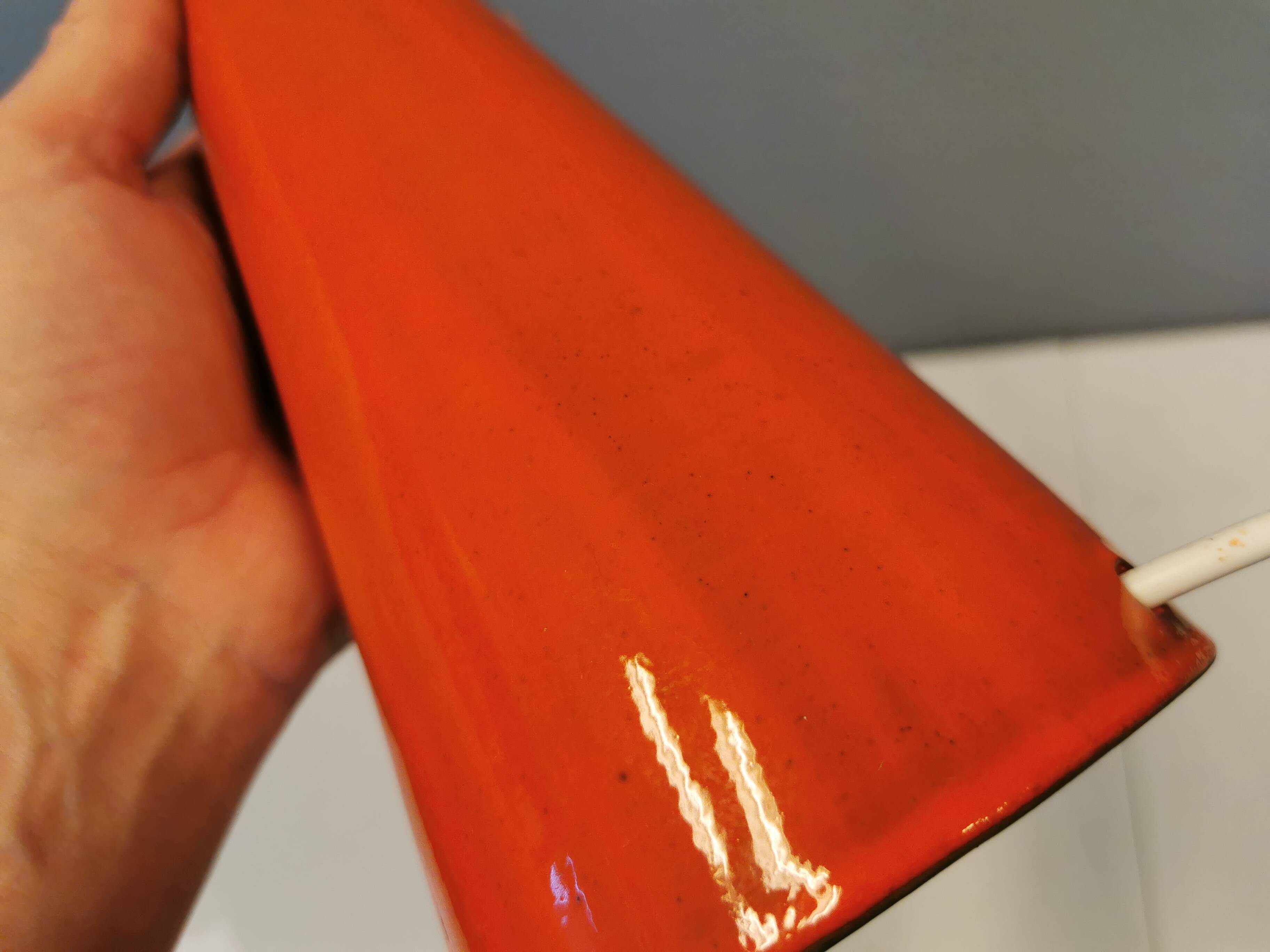 Ceramic table lamp with partial orange glaze.