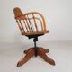Oak office chair with a spring system and height adjustable, 1930s.