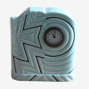 Pendulum clock in art-deco earthenware