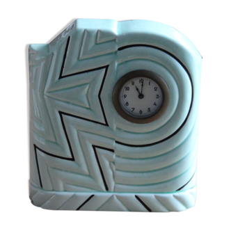 Pendulum clock in art-deco earthenware