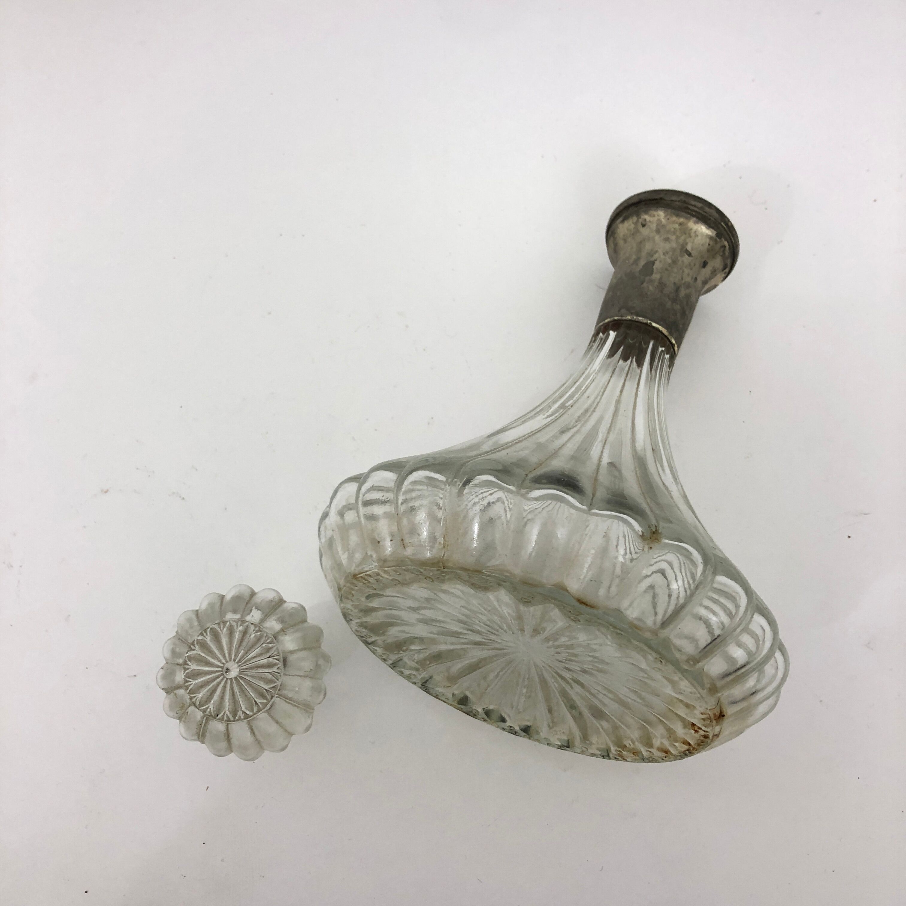 Large glass decanter and tin ring