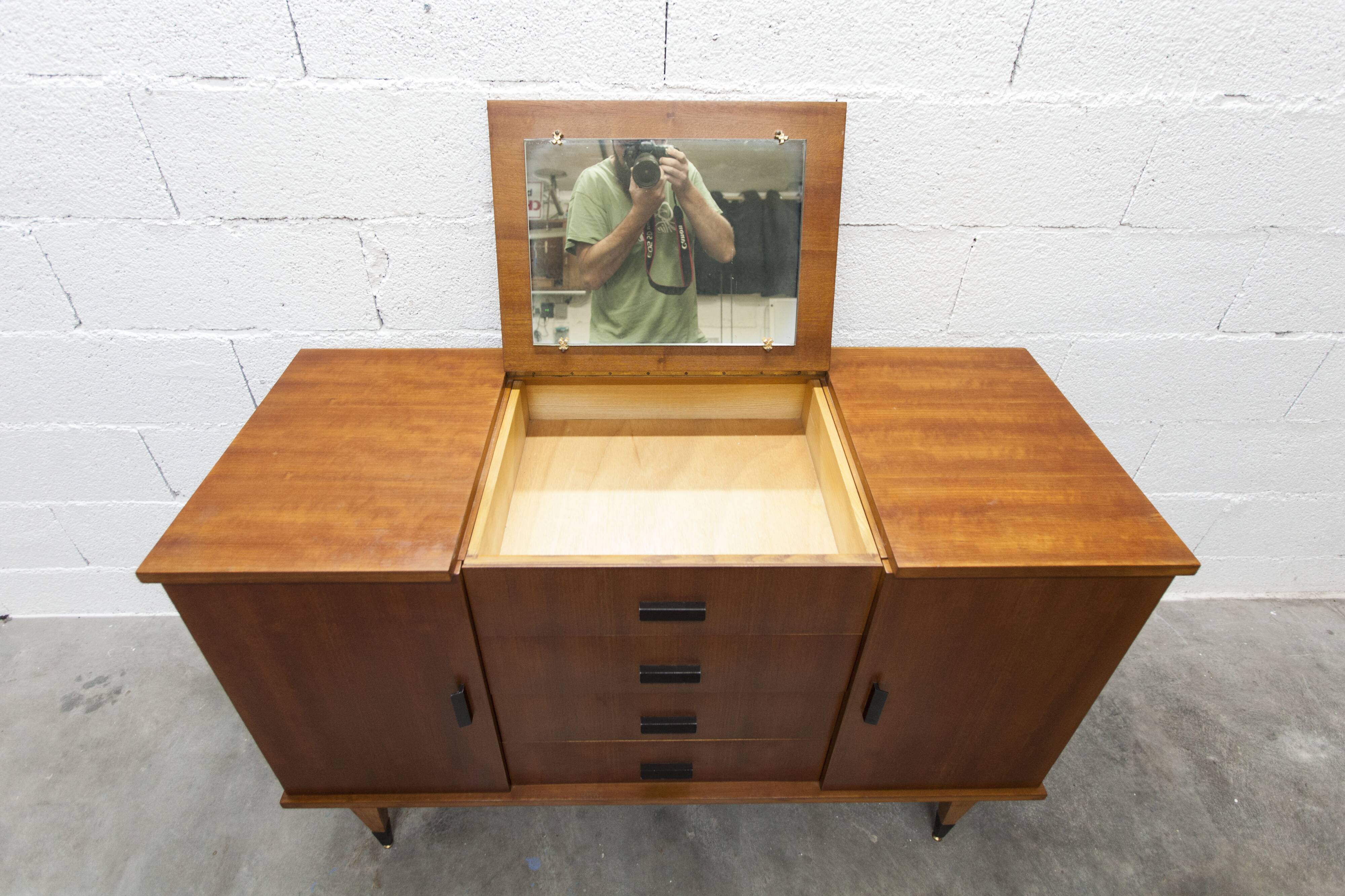 1960s teak sideboard with 4 drawers, 2 doors, and a mirror.