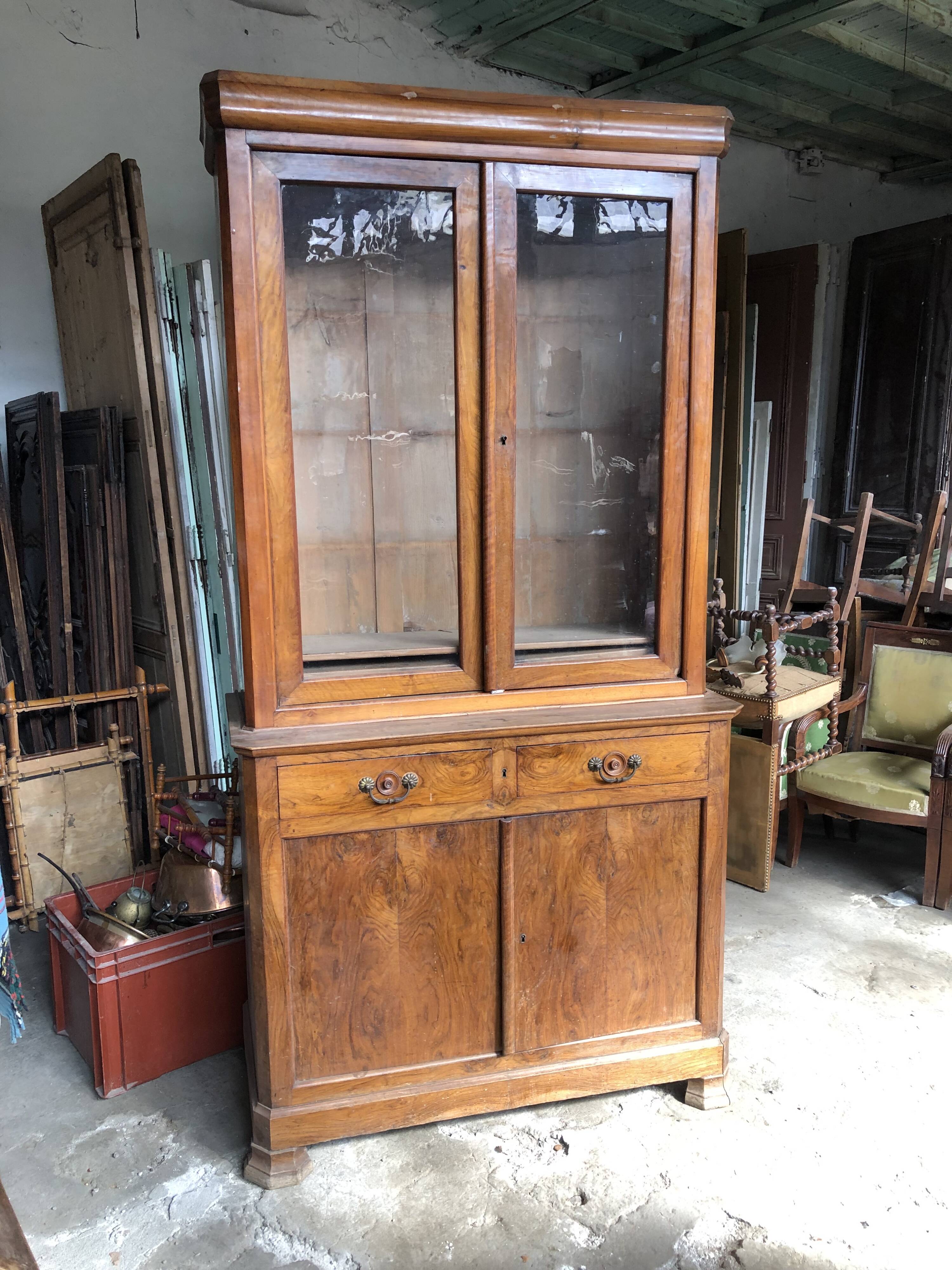 Louis Philippe two-body bookcase in walnut wood.