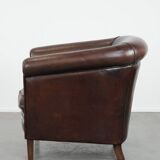 Stylish and sturdy dark brown club armchair made of sheepskin leather