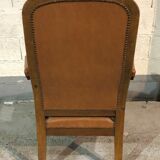 Old Voltaire armchair in light brown leather