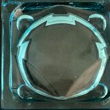 Ashtray paved in blue glass