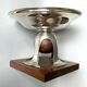 Art deco cut rosewood sphere enclosed in silver metal foot